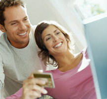 couple with laptop banner
