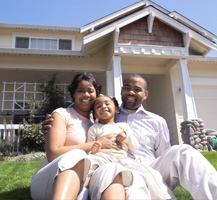 family in front of house banner